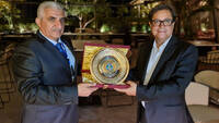Mr Aly Abousabaa receives shield from Dr. Nasr El Din Obeid