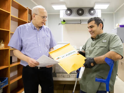 Dr. Hassan Machlab handing over the sealed seed packets to Michael Haddad in Terbol, Lebanon.