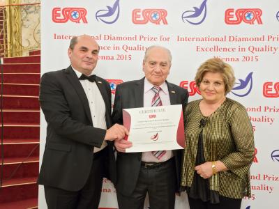 Dr. Michel Afram (left) being awarded "Ambassador of Quality" by the Business Initiative Directions