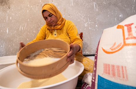 A Morocco cooperative member using industrial flour to make couscous instead of the local harvested grains  