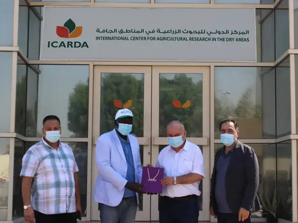 Dr. Abdoul Aziz Niane (center left), Dr. Azaiez Ouled Belgacem (center right)