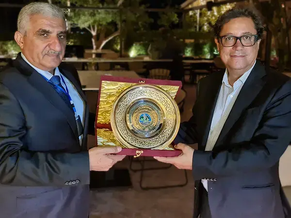 Mr Aly Abousabaa receives shield from Dr. Nasr El Din Obeid