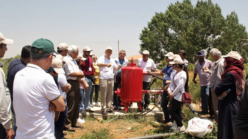 ICARDA scientists training farmers and technicians on how to use the newly-implemented irrigation system