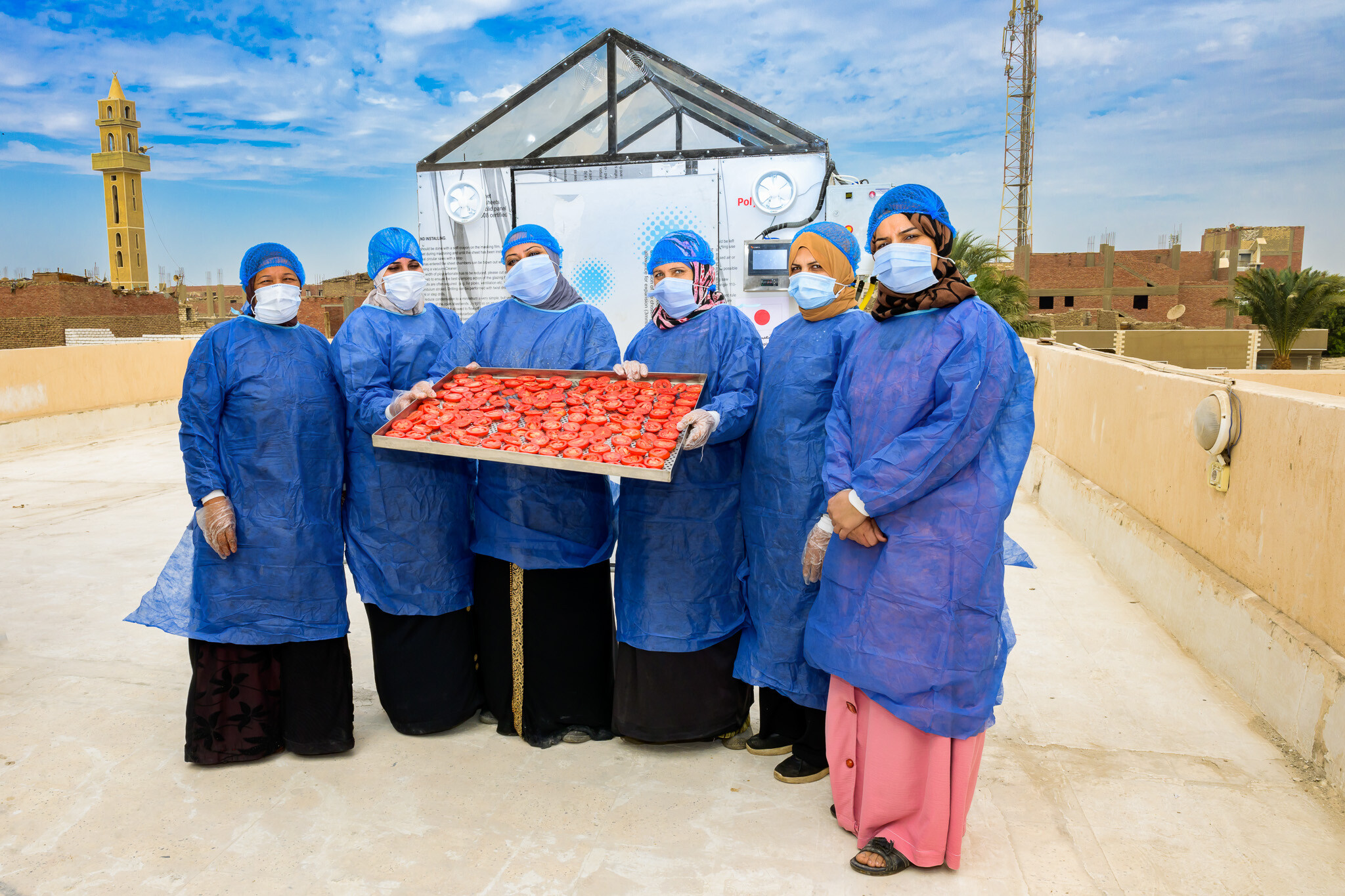 Trained women exploring their first steps towards a successful drying process using the Hybrid Solar drier design based on the location-tailored conditions | Minya, Egypt | Photo: Ahmed ElSheemy/ICARDA