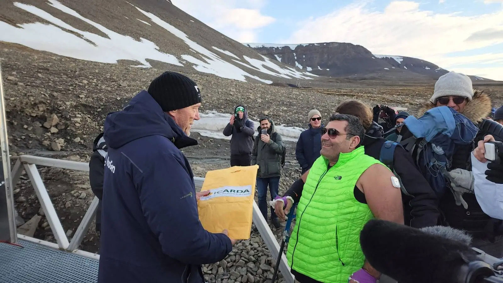 UNDP Goodwill Ambassador and endurance athlete Michael Haddad delivering ICARDA seeds to Dr Asmund Asdal at the Svalbard Global Seed Vault after completing his Arctic Walk. 2022.