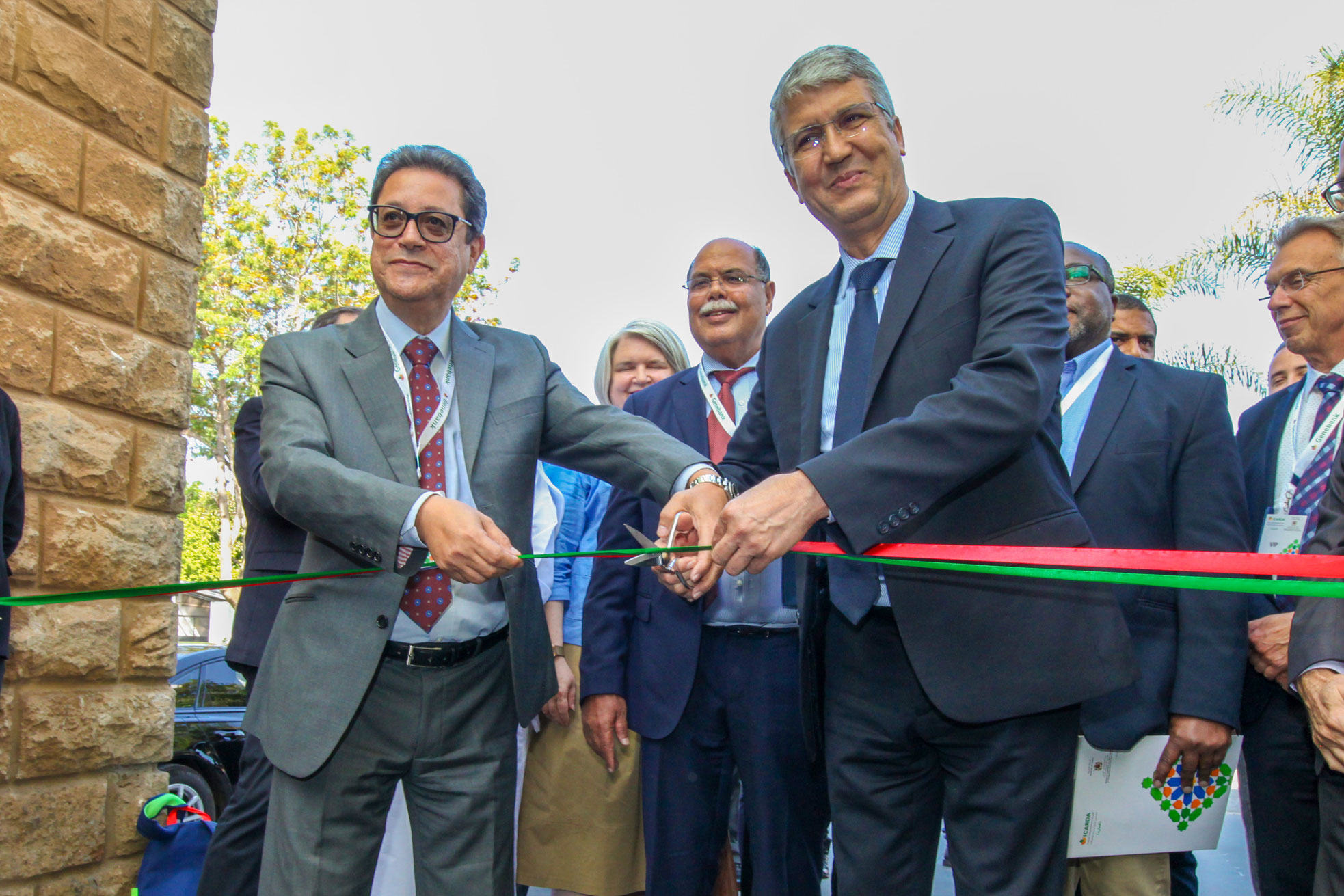 Mr. Aly Abousabaa, ICARDA Director General, and H.E. Dr. Mohamed Sadiki, former Minister of Agriculture of Morocco, cut the ribbon to inaugurate ICARDA's genebank in Rabat, 2022. Photo by James Pursey/ICARDA.